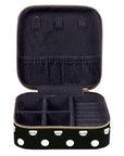 Black jewelry case with gold polka dot accents on a white background