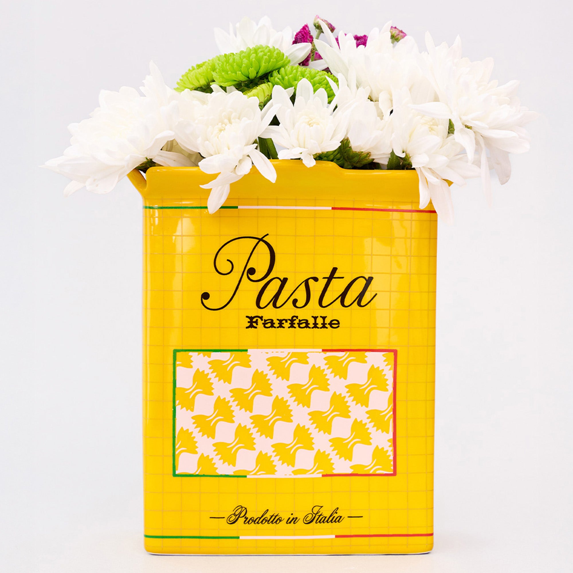 yellow pasta box vase with flowers inside