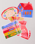 Set of colorful stickers with a house, bookshelf, and cat on a light gray background