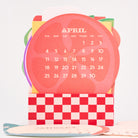 April calendar with colorful border on a white background