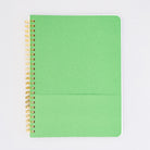 green interior pocket of cream mini notebook with colorful folk graphics and 'i'd rather be home reading' across the center