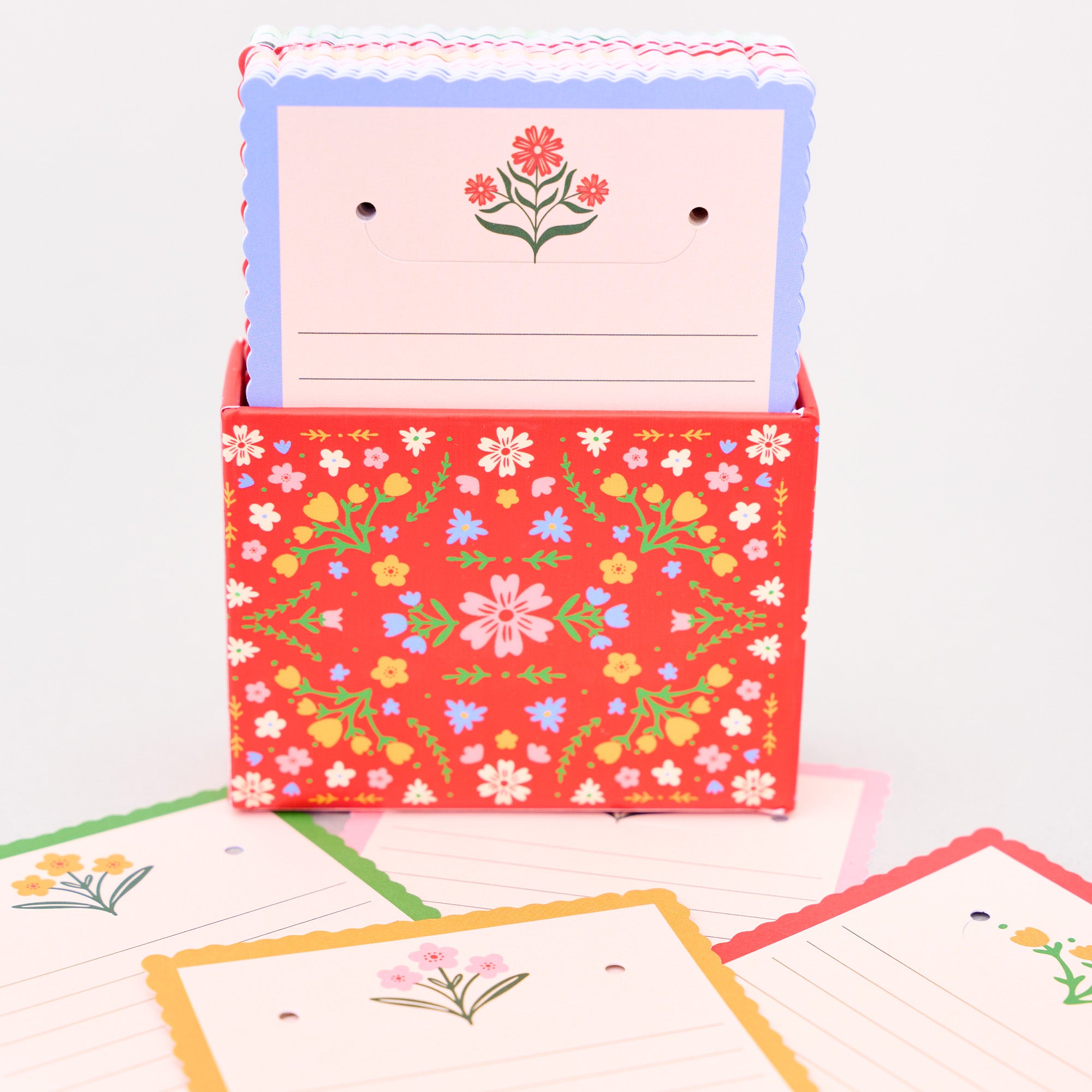 Floral-patterned card in a matching box on a white background