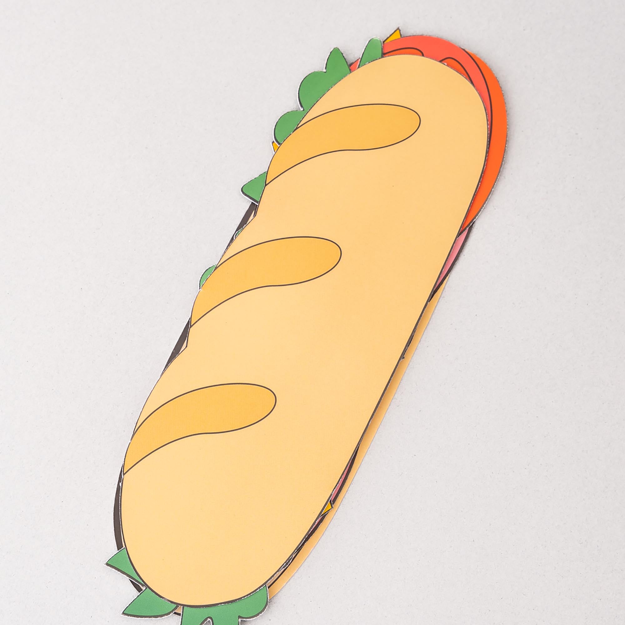 Cartoon-style burrito plush toy on a light gray background
