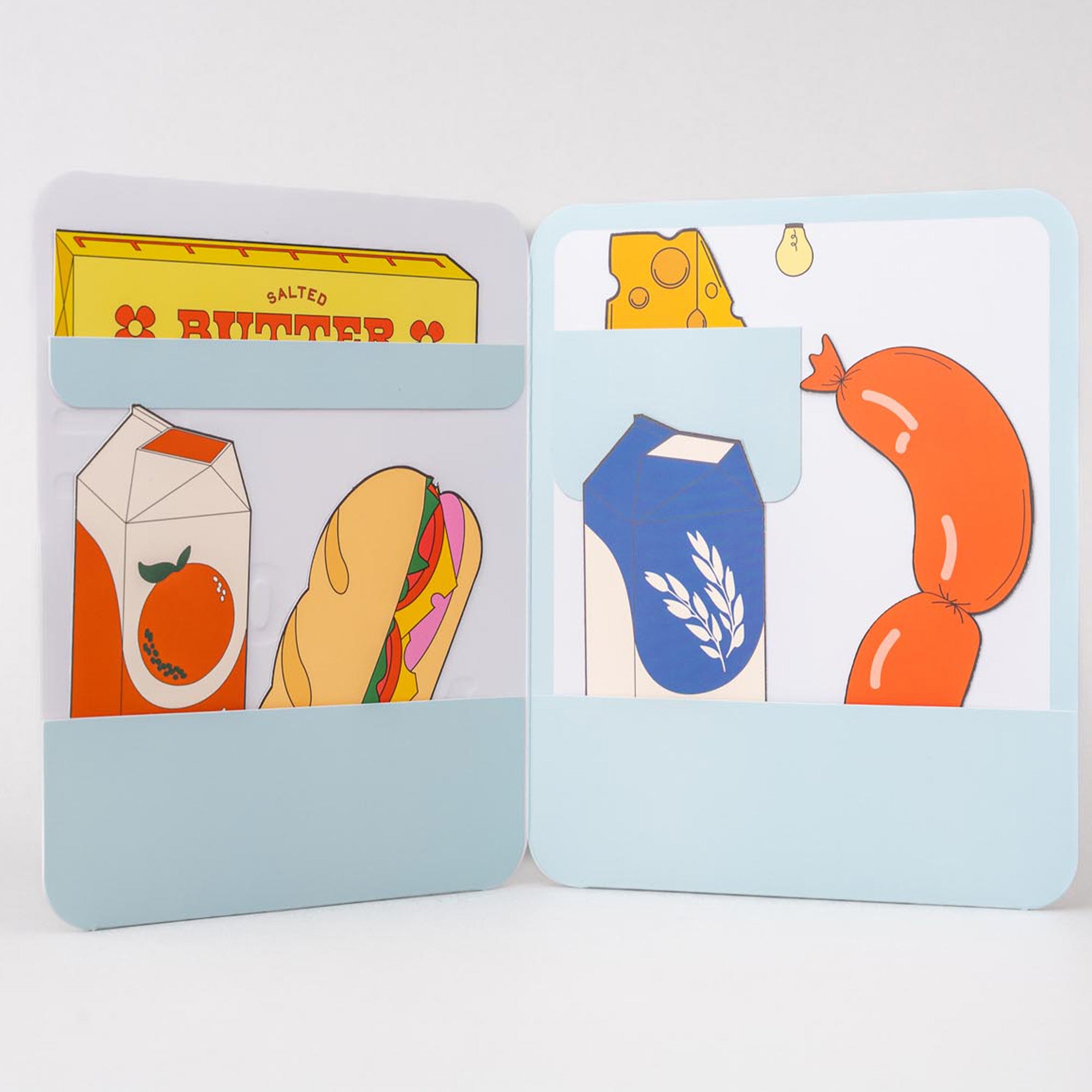 Two card holders with illustrated food items on a light gray background