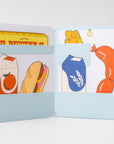 Two card holders with illustrated food items on a light gray background