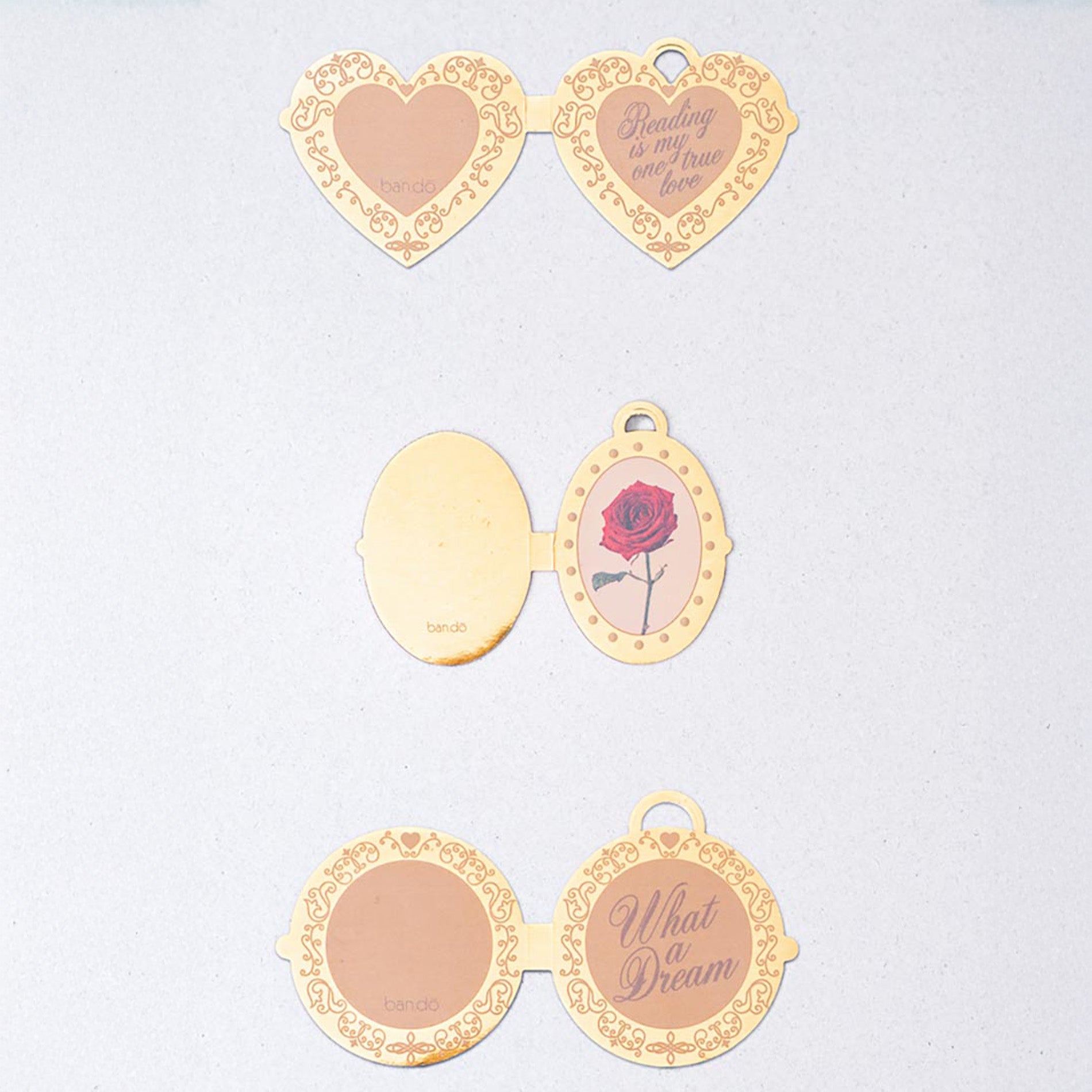 Heart-shaped bookmarks with decorative frames on a light gray background