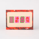 Playing card set with decorative border featuring cherries on a white background