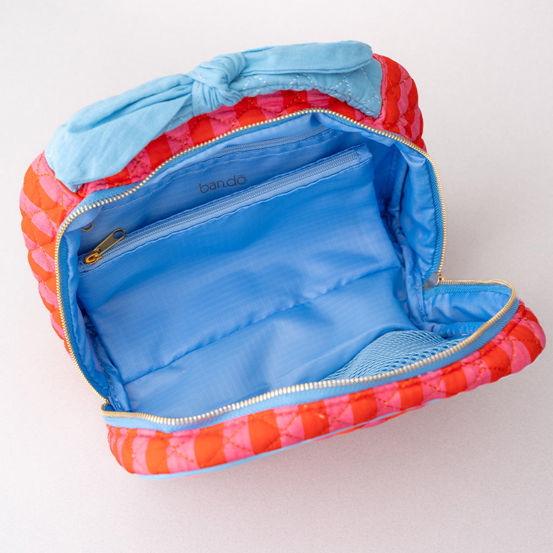 Colorful quilted pouch with a zipper on a white background