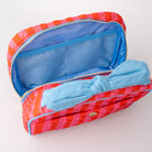 Red and pink pouch with blue interior and bow on a white background