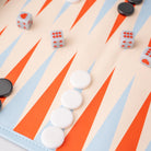 Backgammon board with white pieces, black pieces, and dice on a colorful board