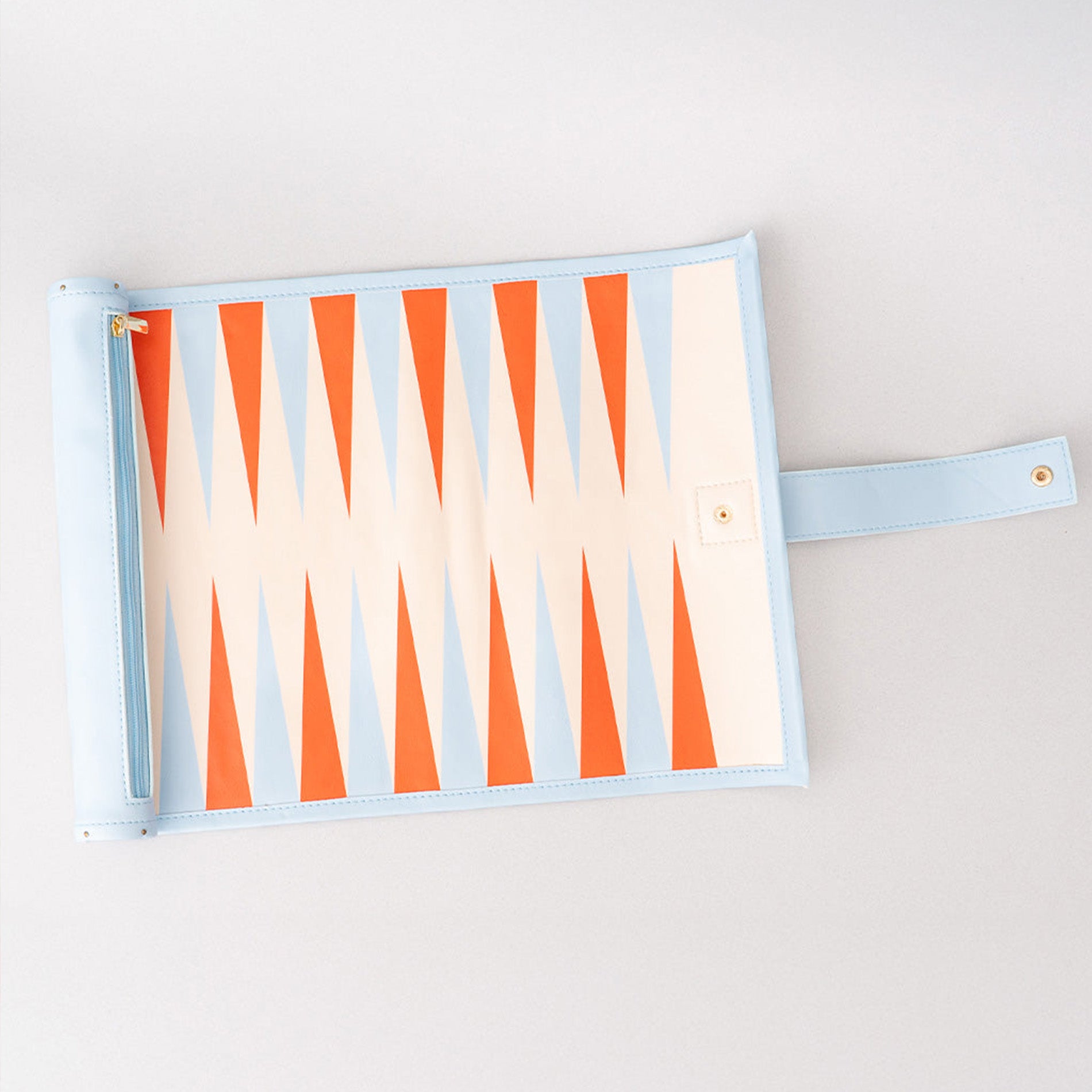 Rectangular pouch with orange and beige striped pattern on a light gray background