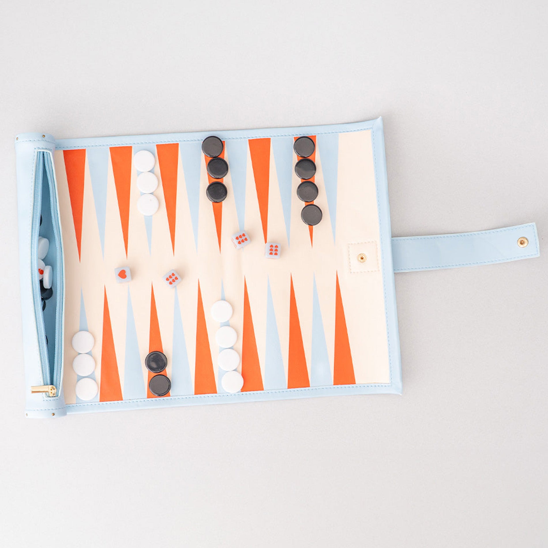 Backgammon board with pieces on a light gray background