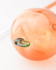 Close-up of a peach with a white background