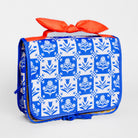 A rectangular soft-sided bag with a blue and white floral block-print pattern, featuring a bright orange-red satin bow on top and a matching blue zipper pull, shown on a light gray background.