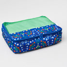 A rectangular zippered travel organizer bag with a blue floral patterned exterior and a green mesh top window, shown on a light gray background.