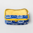 A rectangular mesh organizer pouch with a blue and white floral patterned fabric base, a yellow zipper, and a yellow mesh top, shown on a light gray background.