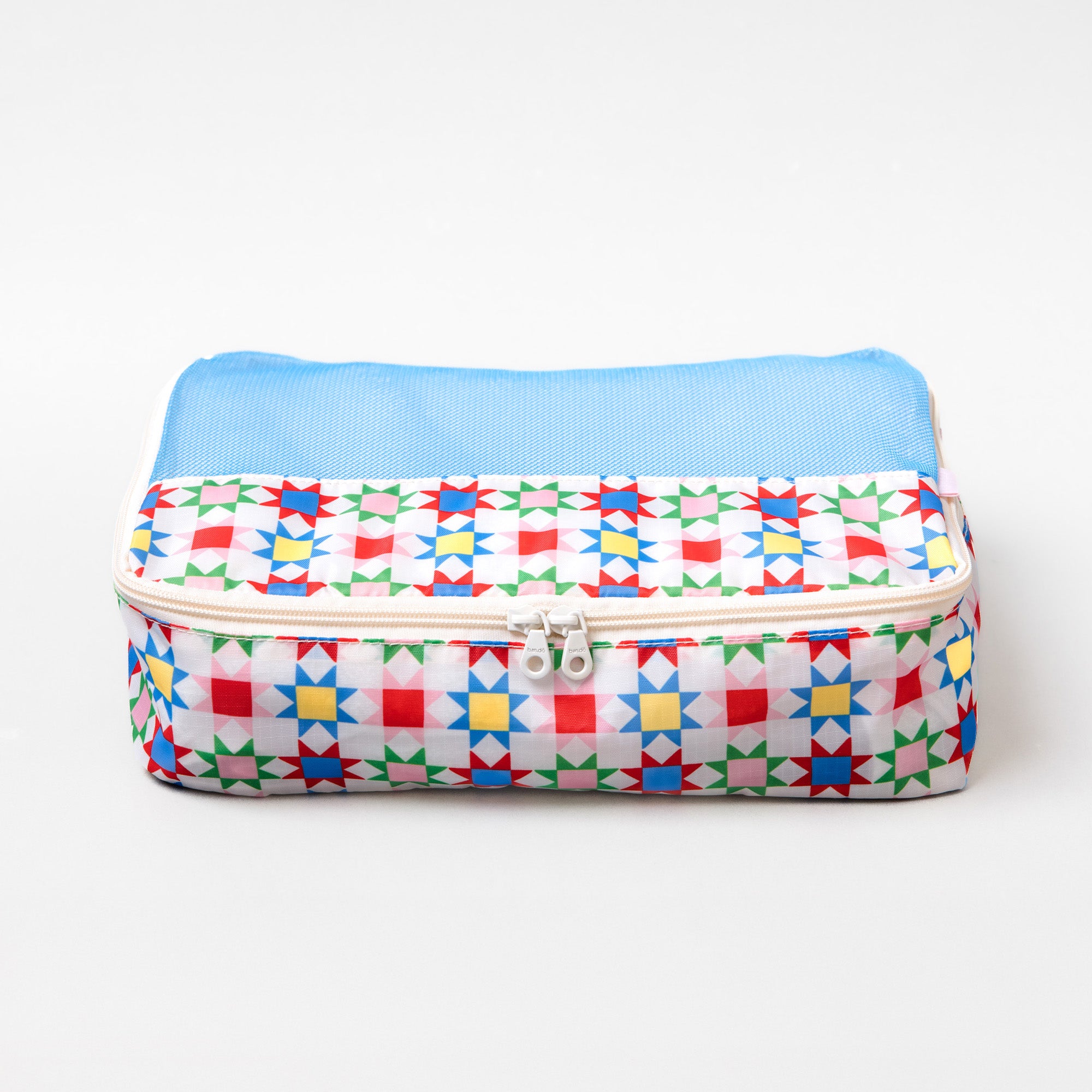 A rectangular zippered pouch with a colorful geometric star pattern on a white background and a light blue mesh top, shown on a plain white studio background.
