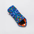 A quilted fabric sunglasses case with a blue background and a colorful floral print, shown on a light gray background with sunglasses inside.