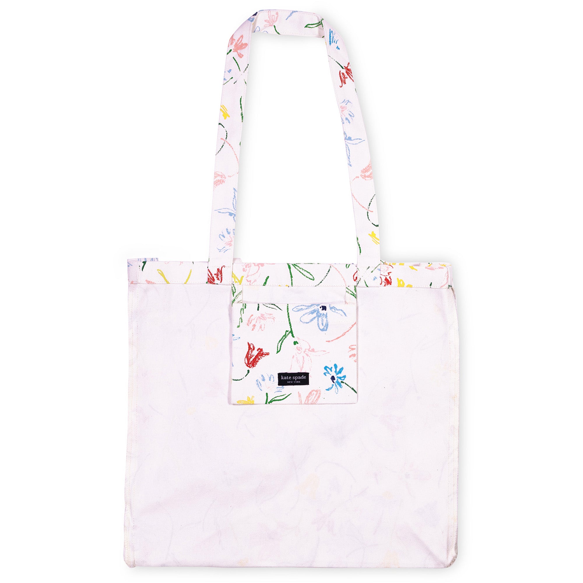 A white tote bag with a multicolor floral and butterfly print on the handles, top trim, and front pocket, shown against a plain white background.