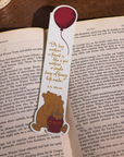 Bookmark with a bear and balloon design on an open book