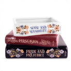 Stack of books with 'Pride and Prejudice', 'Persuasion', and 'Sense and Sensibility' on a white background