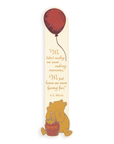 Bookmark with Pooh bear holding a red balloon and a quote by A.A. Milne on a white background