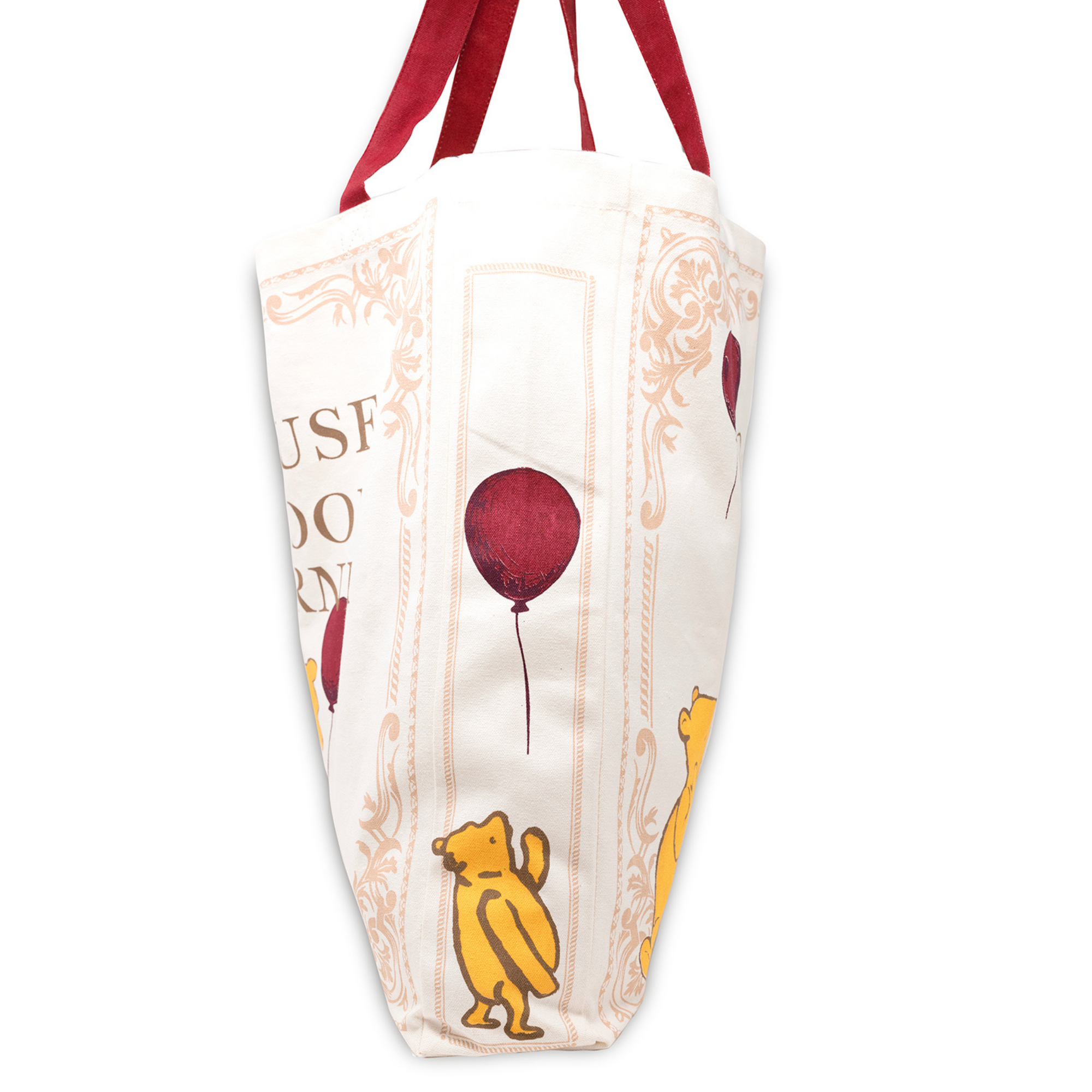 Bag with Winnie the Pooh design featuring a red balloon on a white background