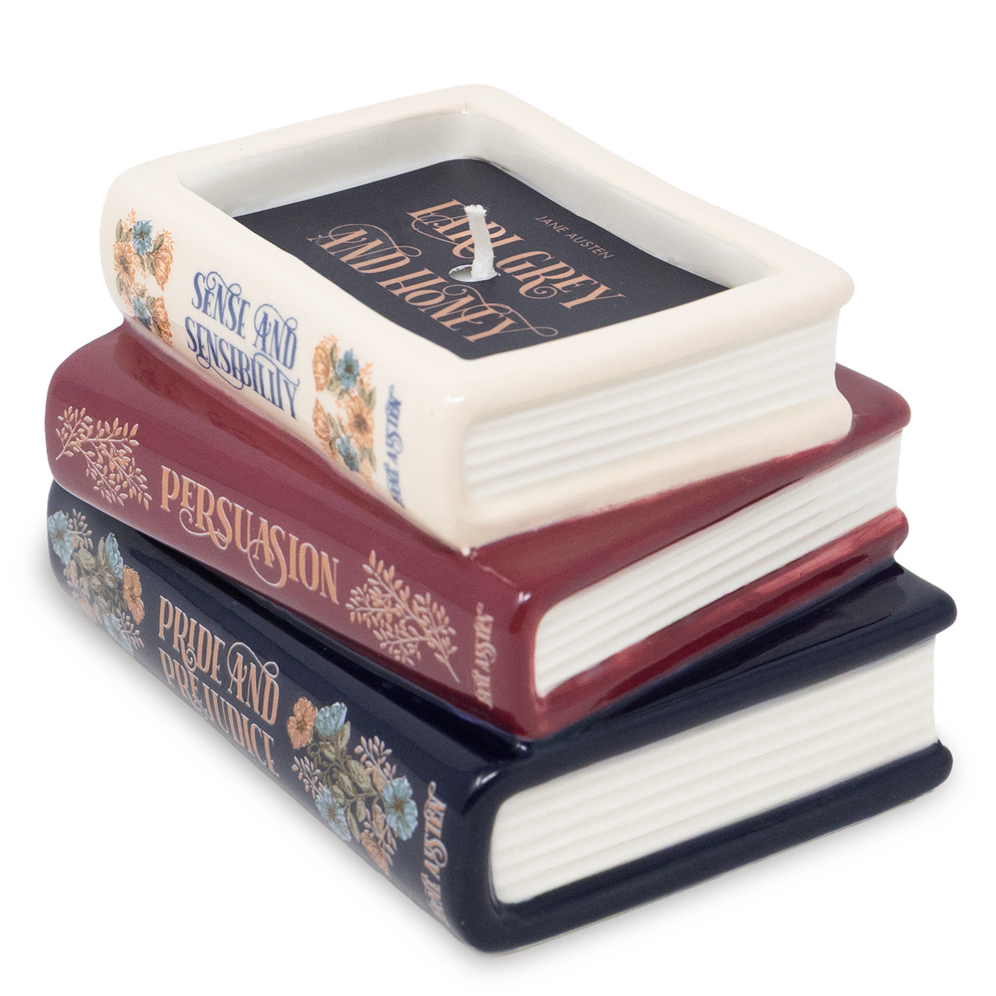 Stack of ceramic books candles with book titles on a white background