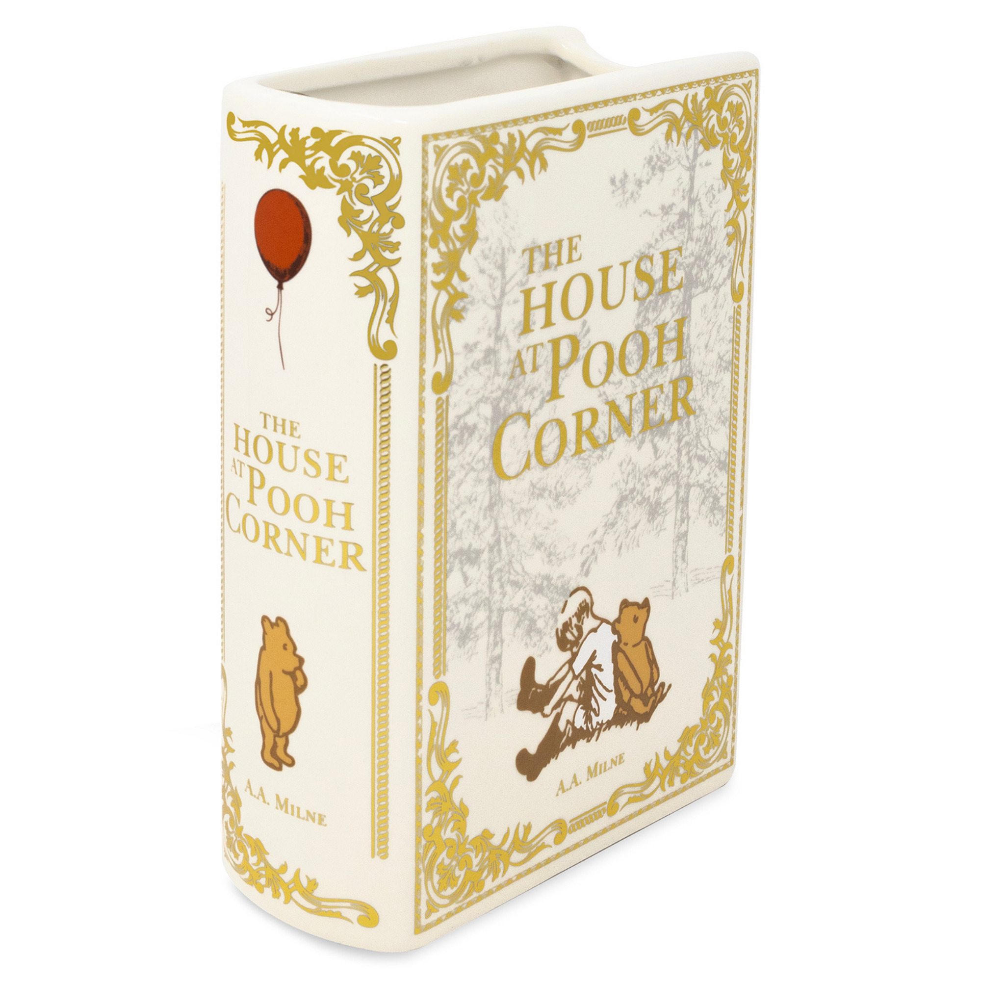 Book-shaped container with 'The House at Pooh Corner' design on a white background