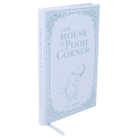 Book titled 'The House at Pooh Corner' with a decorative cover on a white background