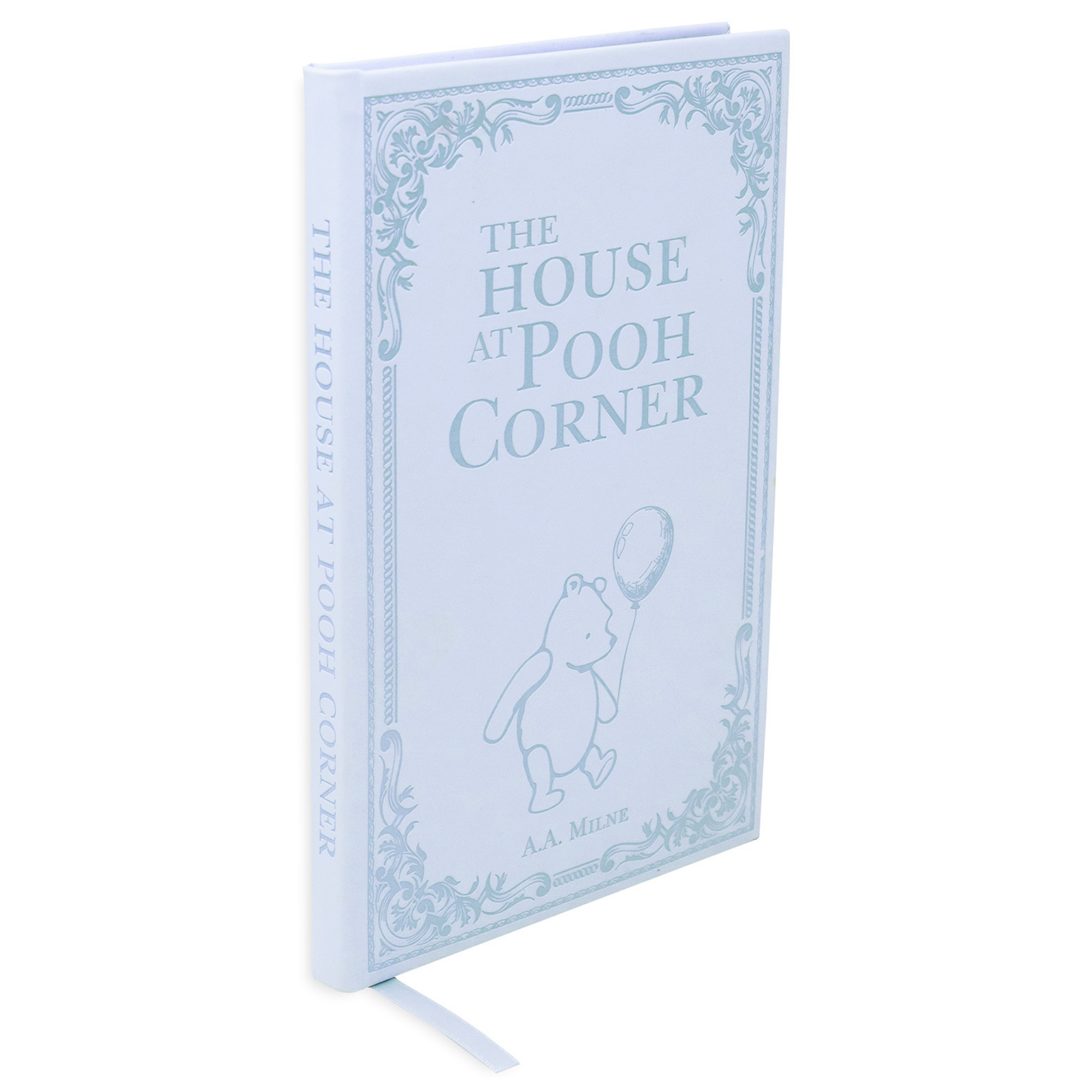 Book titled 'The House at Pooh Corner' with a decorative cover on a white background