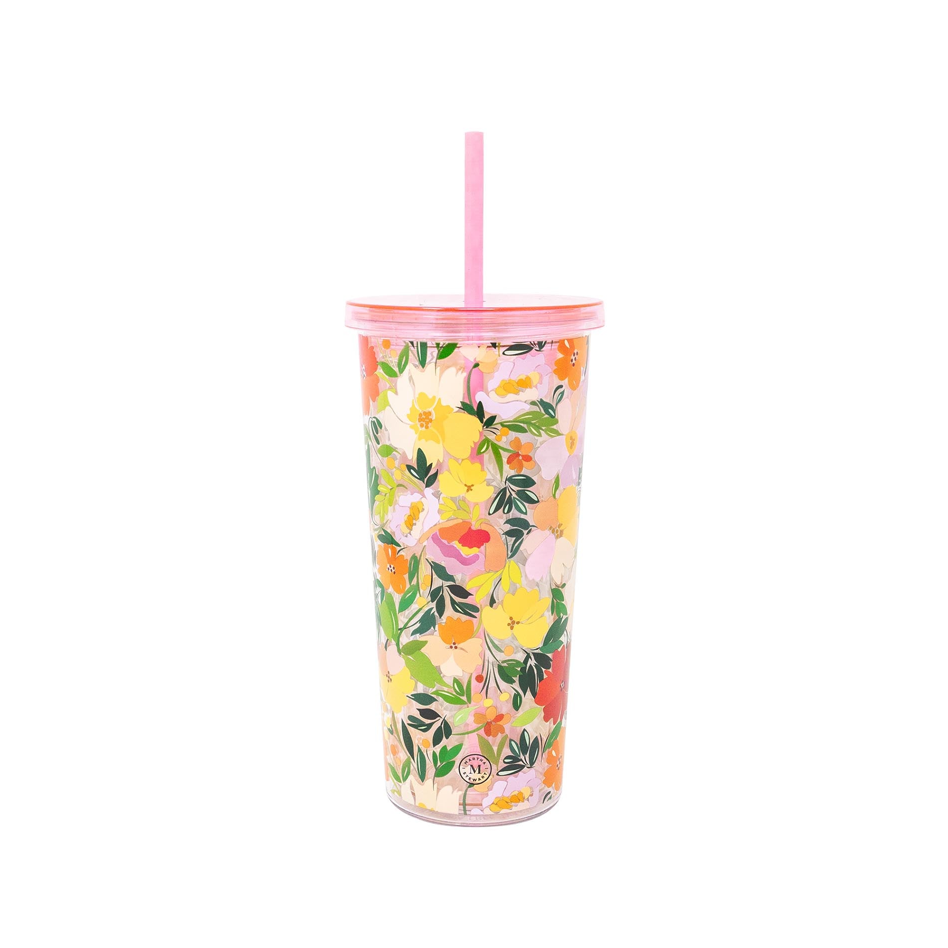 Floral-patterned tumbler with a straw on a white background