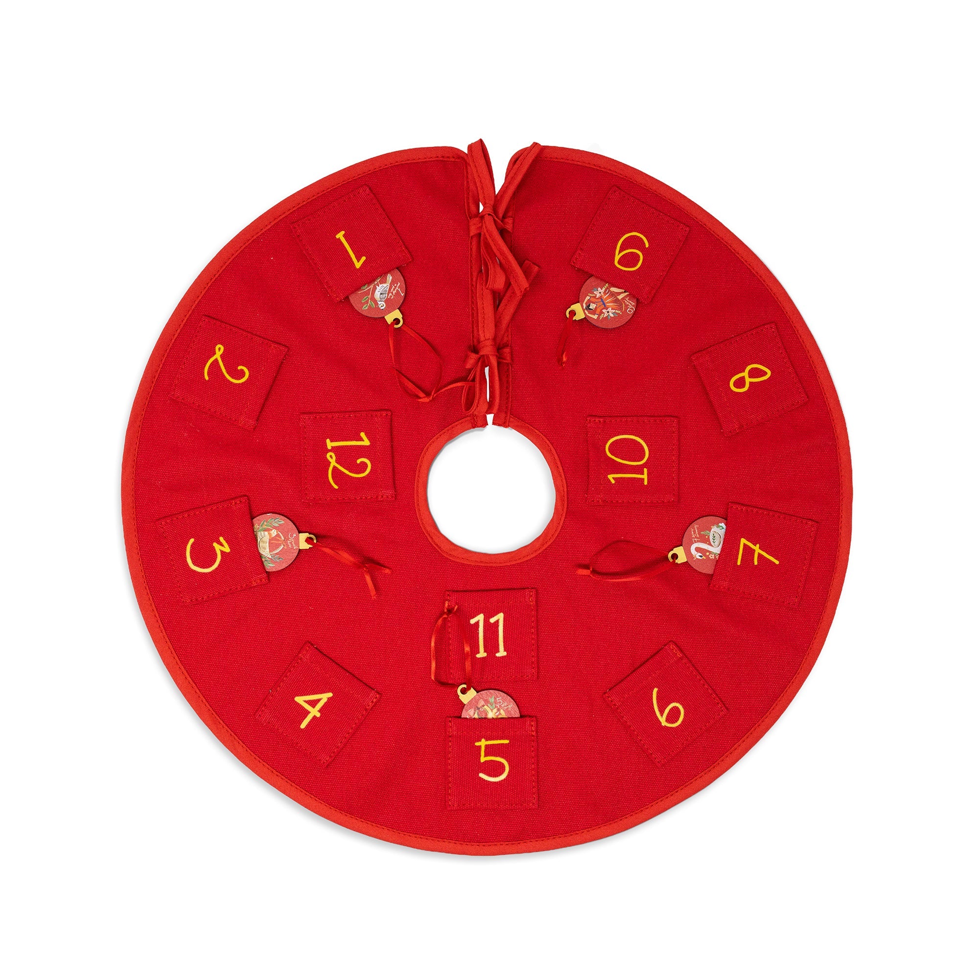 A red Christmas advent circle with ten numbered pockets (1 through 12) arranged around a central hole, each pocket decorated with a small hanging ornament, shown on a plain white background.