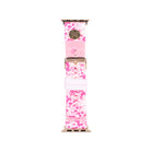 Pink floral patterned watch band with gold clasp on a white background
