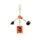 bag charm with enamel metal charms of a bow, cauldron, red rose, and ACOTAR book cover 