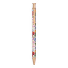 Floral-patterned pen with gold accents on a white background