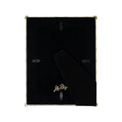 The back of a Lilly Pulitzer picture frame with a black velvet backing and gold-tone metal corners and hinge, shown on a white background.