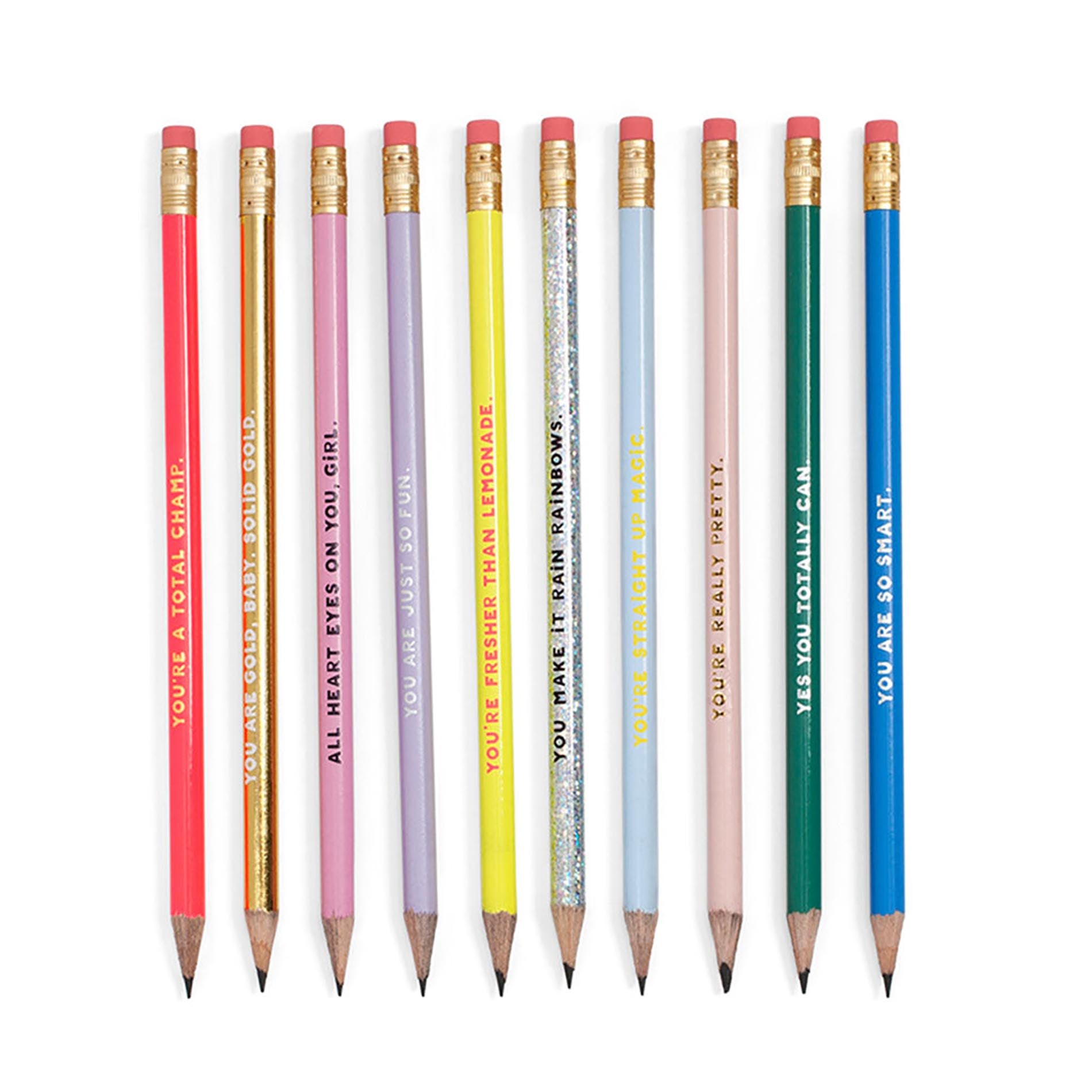 Set of colorful pencils with motivational phrases on a white background