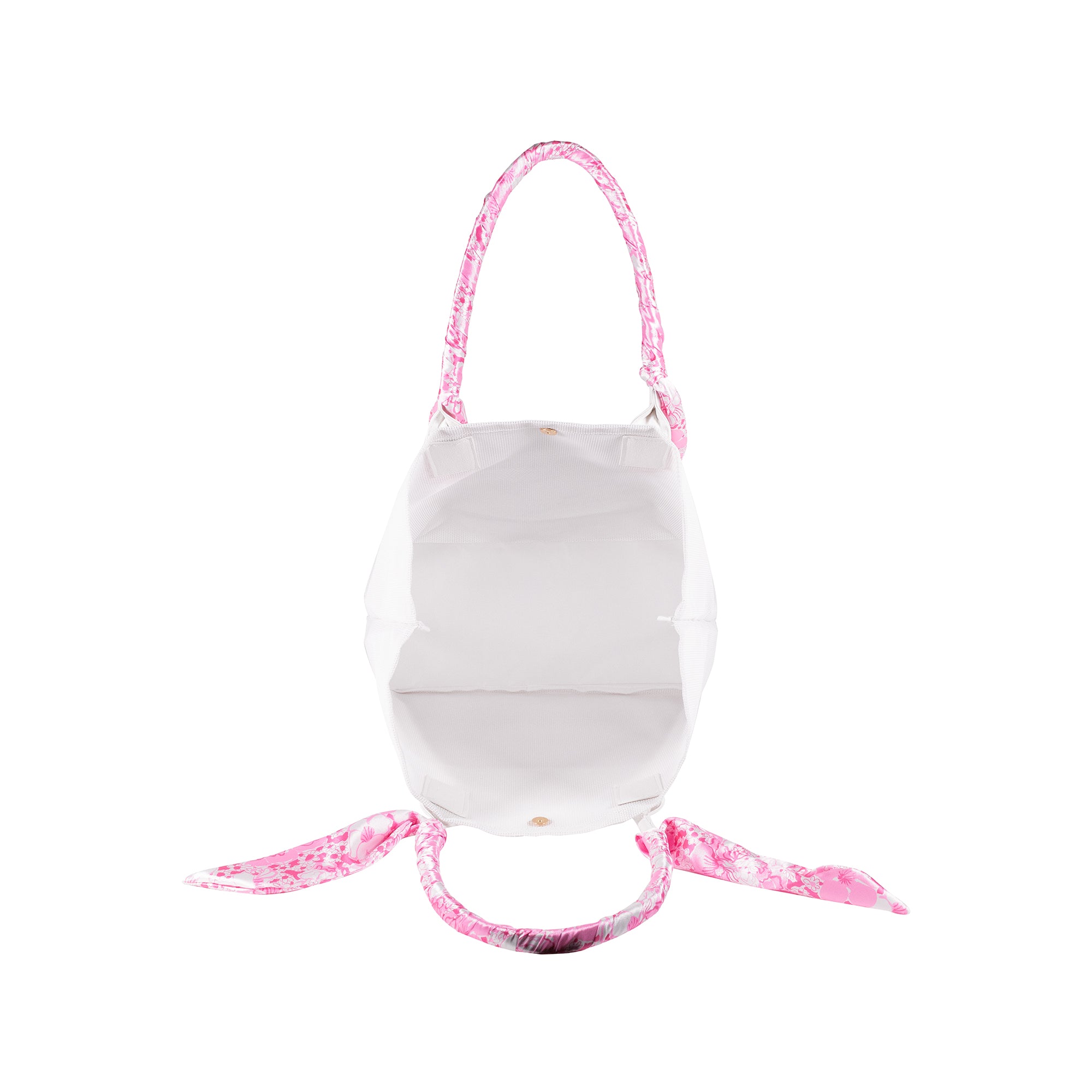 interior of white mesh tote beach bag with pink and white floral handles