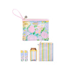 Set of pastel floral pouch, striped pouch, and cylindrical container on a white background