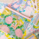 Colorful floral and abstract patterned bags on a matching background