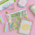 Colorful stationery items on a pink background