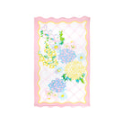 Pink scalloped beach towel with colorful floral design