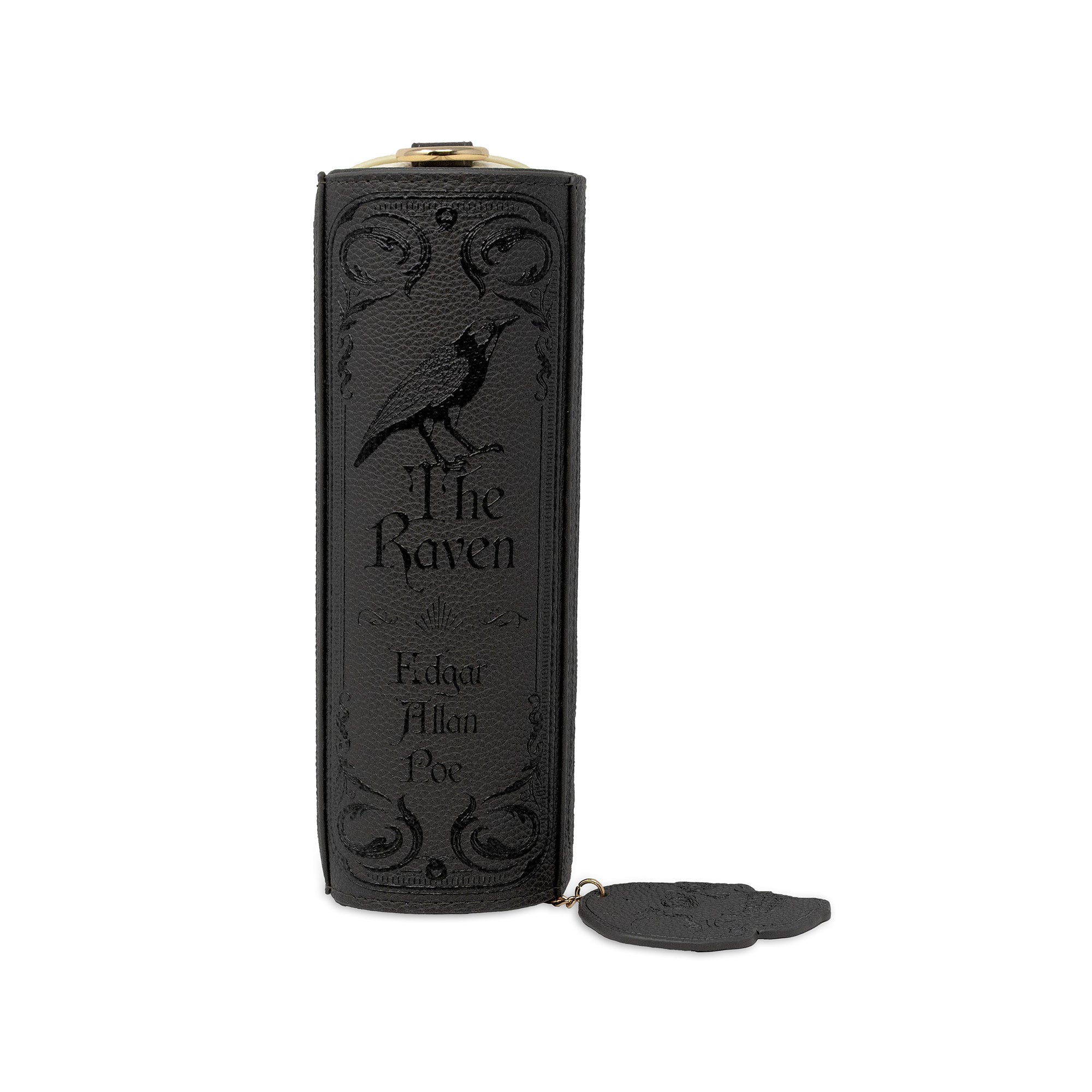 A black leather-like bag with embossed gothic-style raven artwork and the words 'The Raven' and 'Edgar Allan Poe' on the front, shown upright on a white background with a small matching tag attached.