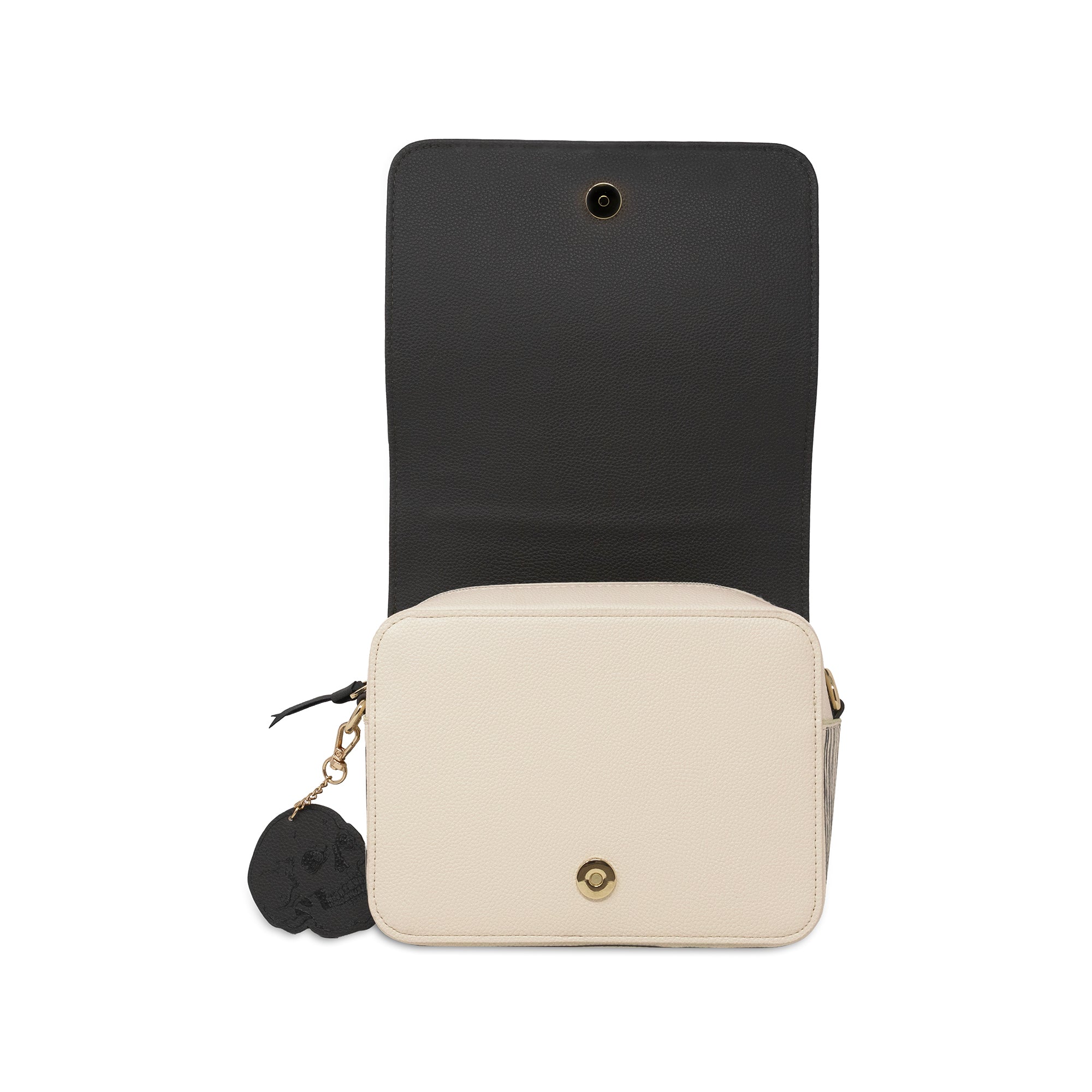A cream-colored rectangular crossbody bag with a black interior flap and a black skull-shaped charm, shown against a plain white background.
