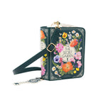 A dark green crossbody bag featuring a colorful floral illustration and the text 'THE SECRET GARDEN' on the front, with a matching key-shaped charm and adjustable strap, shown on a white background.