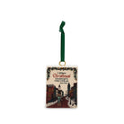 A rectangular Christmas ornament with a dark green hanging ribbon, featuring a vintage-style winter street scene and the text 'I will honour Christmas' on a white background.