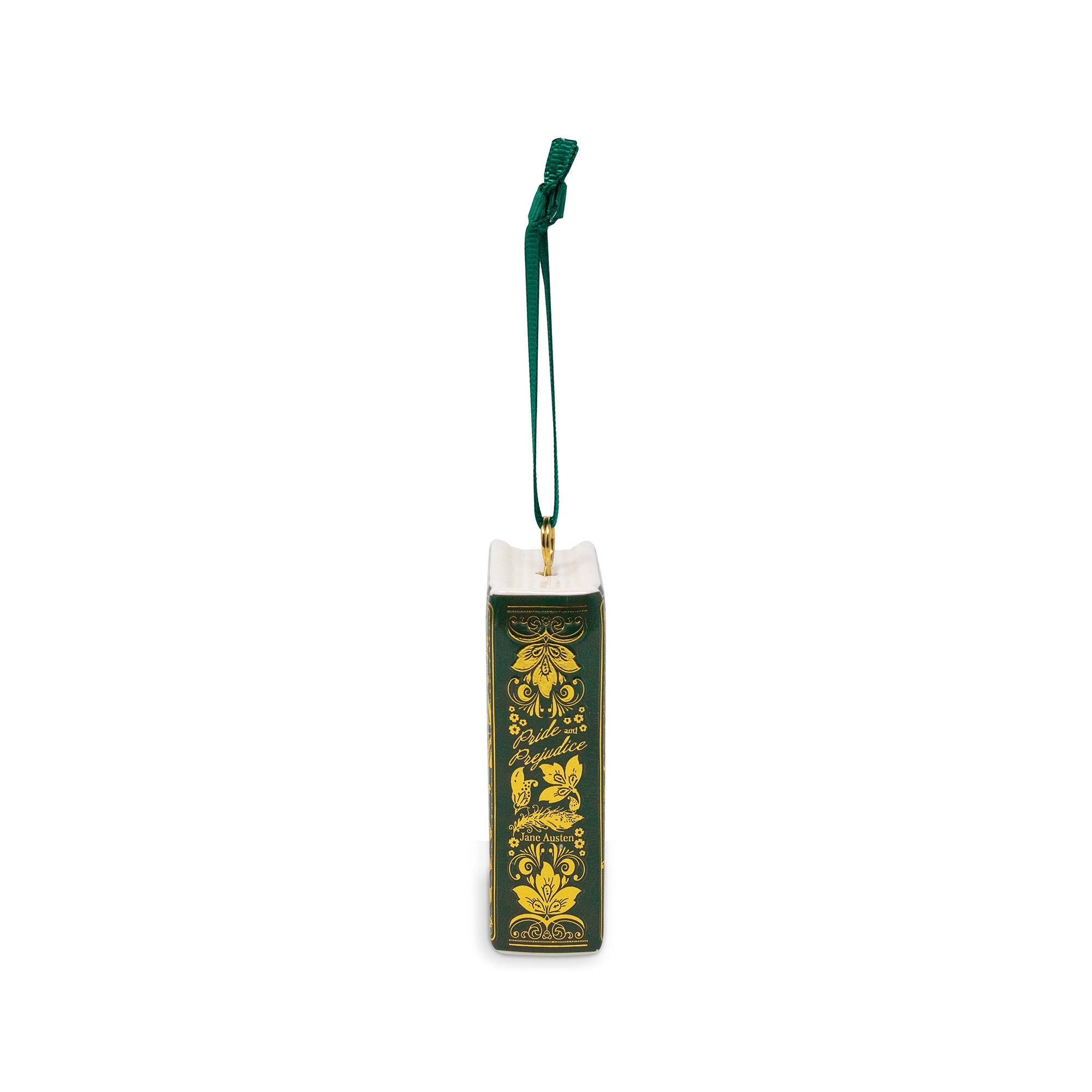 A decorative book-shaped ornament hanging from a dark green ribbon. The ornament is designed to look like an antique book with a dark green cover, ornate gold floral border, and gold script reading 'Pride and Prejudice'.