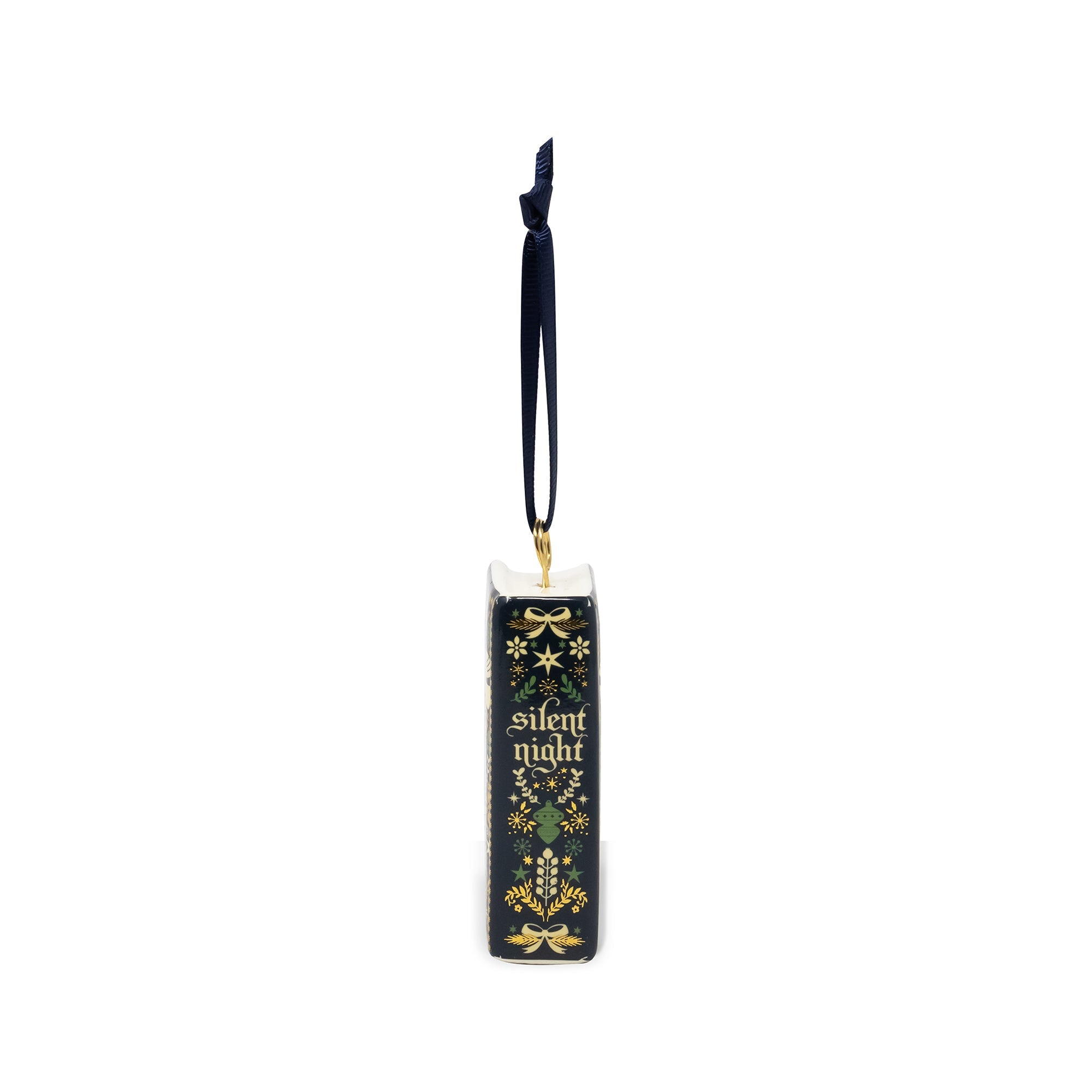 Spine of a decorative book-shaped ornament featuring the title 'A Silent Night' in gold lettering, decorated with a dark navy blue and gold pattern of birds, stars, and musical notes. It has a hanging loop at the top and is shown on a plain white background.