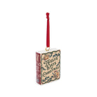 A Christmas book ornament featuring the title 'Twelve Days of Christmas' in decorative lettering, with a red hanging ribbon and a small gold loop at the top, shown on a plain white background.